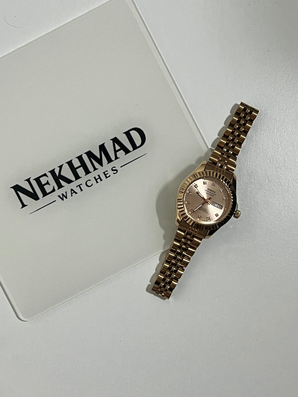 NIBOSI Ladies Rose Gold Watch — Pink Dial — Day & Date — Crystal Markers — Luxury