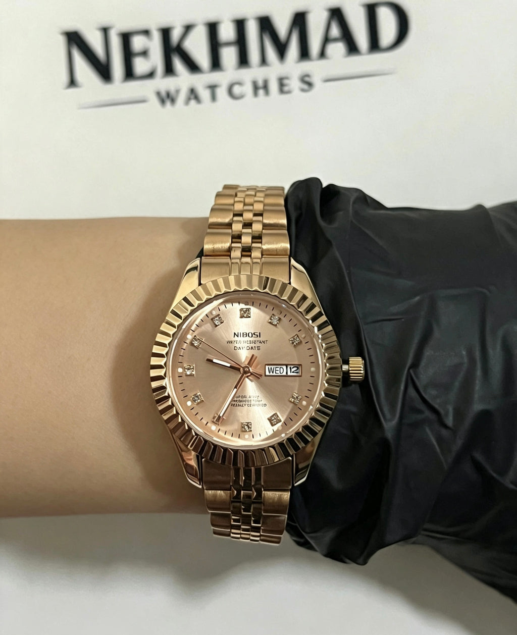 NIBOSI Ladies Rose Gold Watch — Pink Dial — Day & Date — Crystal Markers — Luxury