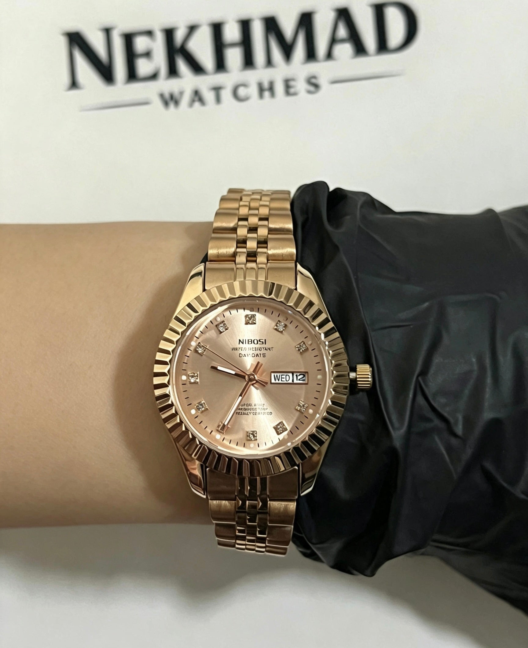 NIBOSI Ladies Rose Gold Watch — Pink Dial — Day & Date — Crystal Markers — Luxury